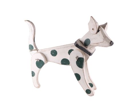 An Andrew Johnstone folk art painted wooden articulated figure of a dog, 70cms long.