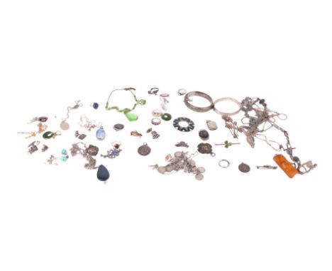 A quantity of silver and costume jewellery to include hinged bangles, silver fobs and niello cufflinks.
