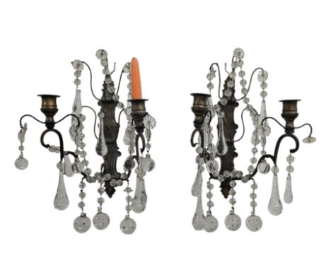 A pair of twin-arm wall lights with cut glass drops, 32cms high (2).