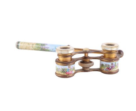 A pair of 19th century French gilt metal and enamel mother of pearl opera glasses with extending handle. Provenance: property