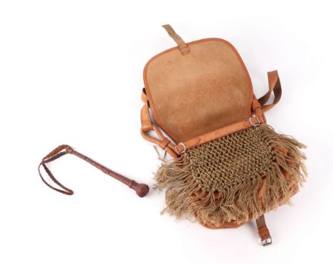 A leather game bag with leather covered fishing priest (2).