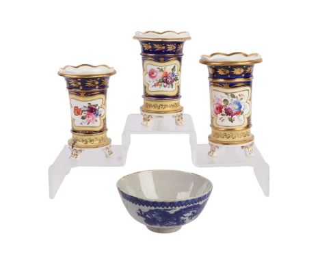 A group of three early 19th century porcelain spill vases decorated with flowers, the largest 14cms high; together with a blu