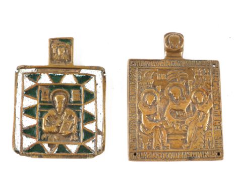 Two Russian cast brass icons, one of the Old Testament, Trinity, the other of St Basil the Great, decorated in white and gree