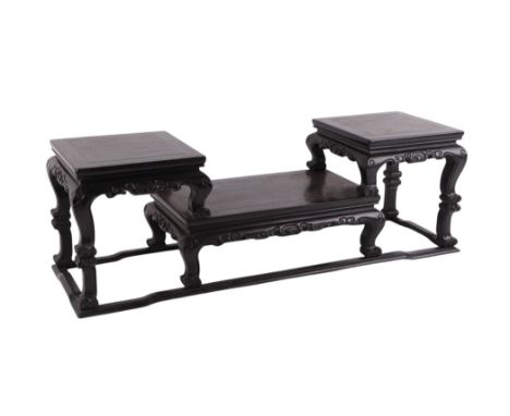 A Chinese carved hardwood (possibly Zitan) three-tier vase stand, 69cms wide, 20cms depth, 23cms max height.Condition ReportG