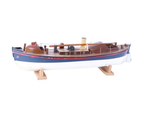 An early 20th century Bassett-Lowke clockwork lifeboat with carved wooden hull, lined decks, folding mast, copper wheelhouse,