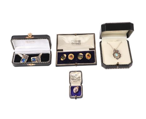 A silver pendant set with white stones, on a fine chain; together with a pair of gilt and enamel cufflinks; a pair of white m