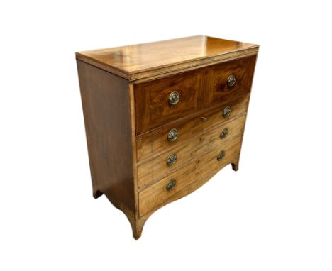An early 19th century mahogany secretaire chest, the top drawer opening to reveal a fitted interior above three graduated lon