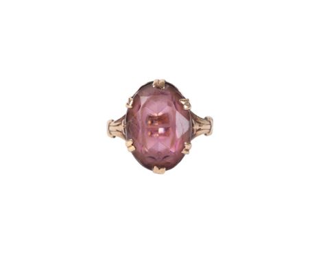 A 9ct gold ring set with a large oval amethyst, approx UK size N, 3.9g.
