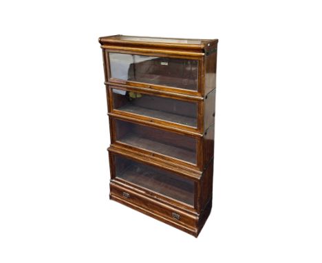 An early 20th century Globe Wernicke walnut Barrister's four-section stacking bookcase with single drawer beneath, 87cms wide