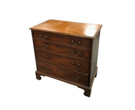 An early 19th century mahogany chest of four graduated long drawers, on bracket feet, 85cms wide.