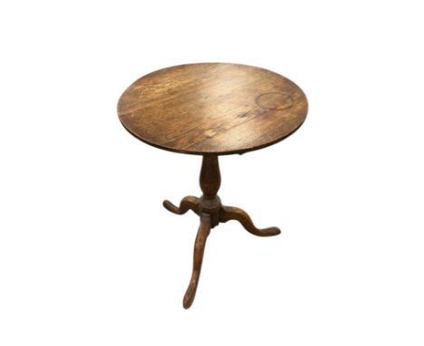 An early 19th century oak tilt-top occasional table on turned column and tripod base, 60cms diameter. Provenance: property of