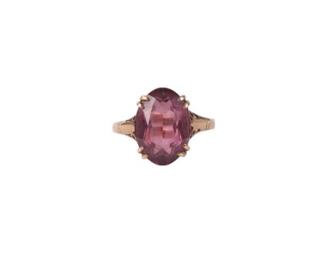A 9ct gold ring set with a large oval amethyst, approx UK size N, 2.5g.