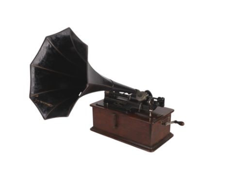 An early 20th century Edison Home Phonograph, serial no. 334555, in an oak case, 40cms wide, with a good selection of wax cyl