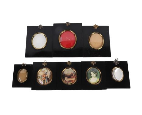 A group of ebonised portrait miniature frames, the largest overall 12.5 by 16cms (8).