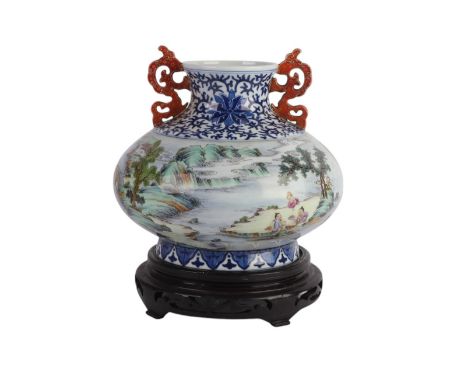 A Chinese famille rose two-handled squat vase decorated with figures in a landscape, blue seal mark to the underside, on a ha