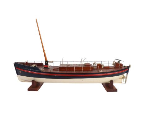 An early 20th century Bassett-Lowke clockwork model of a lifeboat, the hull finished in RNLI colours of blue, red and white, 