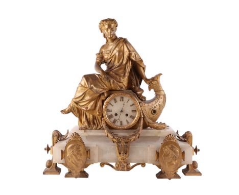 A 19th century French Empire style gilt spelter and alabaster figural mantel clock with a neoclassical figure above the alaba