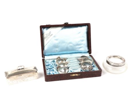 A silver topped cut glass dressing table box; together with a set of white metal teaspoons with rose terminals and a silver m