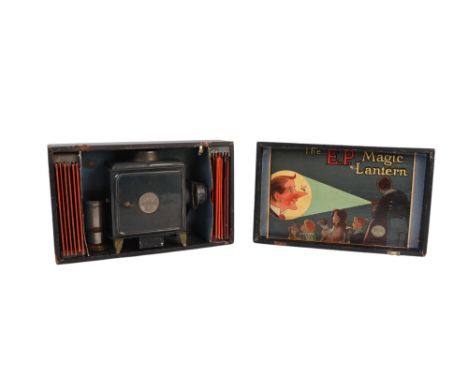 A late 19th century Ernst Plank (EP) Standard Magic Lantern with a selection of twelve magic lantern slides, boxed, 27cms wid