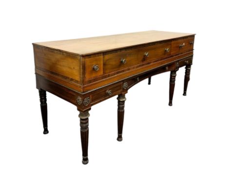 A William IV square piano converted to a sideboard with an arrangement of eight drawers, on eight turned and reeded legs, 170