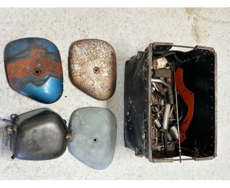 A quantity of assorted Triumph motorcycle spares including an oil tank, side panels, levers and other items.