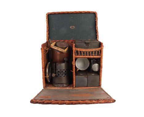 An Edwardian period wicker cased two-person tea and picnic set by Stewart Dawson & Co Ltd, Hatton Garden, London, with leathe