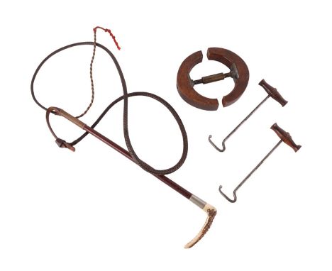 Hunting interest:  A leather riding crop with antler handle; together with a pair of boot pulls with treen handles and a tree