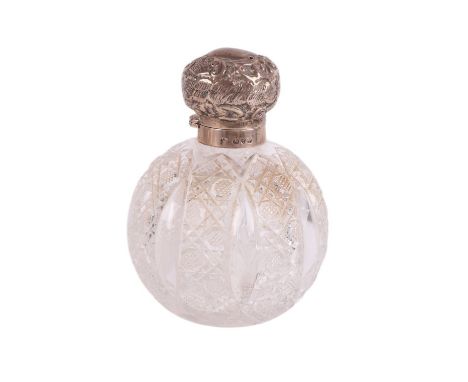 A silver topped cut glass scent bottle of globular form, 13cms high.