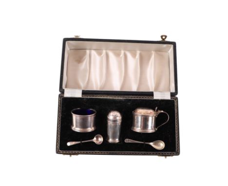 A cased silver condiment set consisting of salt, pepper and mustard with associated spoons, 50g.