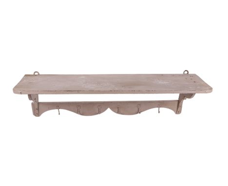A set of distressed painted pine coat hooks with shelf above, 105cms wide. Provenance: property of the late actor Michael Gou