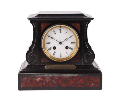 A Victorian black slate mantel clock, the white enamel dial with Roman numerals, 24cms wide.