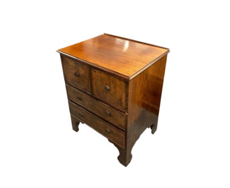 A mahogany side cabinet, the rectangular top above a pair of cupboard doors enclosing drawers, with two long drawers beneath,