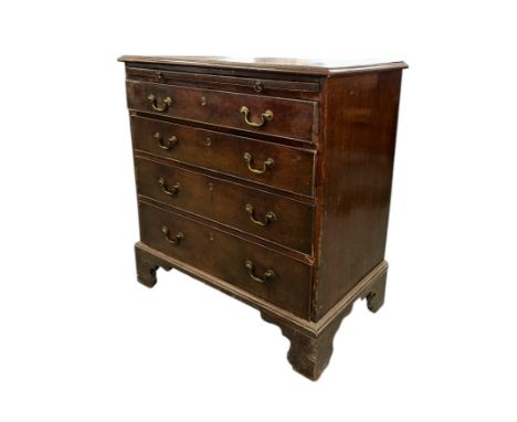 An early 19th century mahogany chest with brushing slide above four graduated long drawers, on bracket feet, 86cms wide. Prov