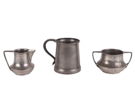 An Arts & Crafts Tudric pewter milk and sugar bowl; together with a Tudric pewter tankard (3).
