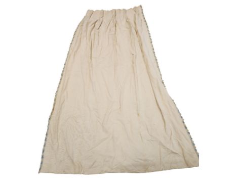 A large quantity of linen triple pleat interlined cream curtains with Colefax & Fowler fan edged trim, largest 125cms fixed t