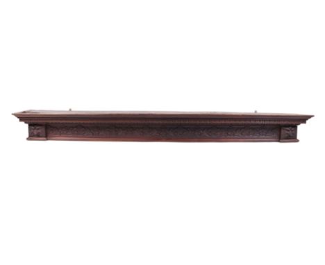 A large carved oak cornice or pelmet, 210cms wide.