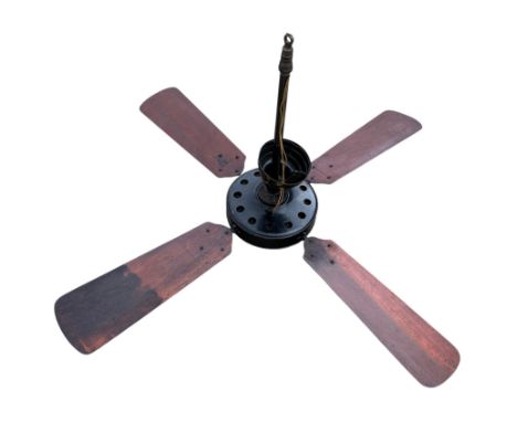An early 20th century Westinghouse Sidewinder cast iron ceiling fan with propeller type blades, 73cms high.