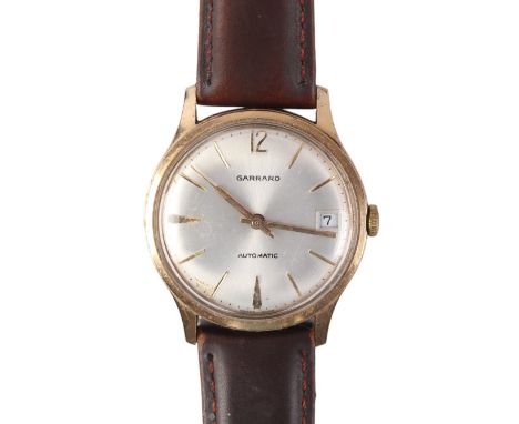 A 9ct gold cased Garrard Automatic gentleman's wristwatch with Long Service inscription to the back.Condition ReportThe case 