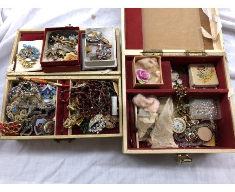 TWO CASES OF COSTUME JEWELLERY INCLUDING BROOCHES, ENAMEL BADGES, NECKLACES, ETC