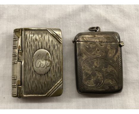 19TH CENTURY SILVER VESTA CASE AND A PLATED STAMP HOLDER IN THE FORM OF A BOOK