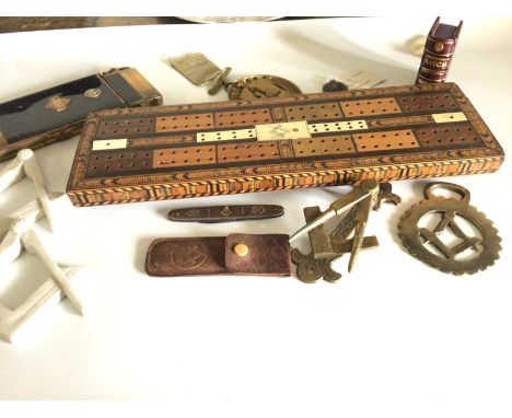 A Masonic inlaid cribbage board a large cigarette box and lighter a pen knife door knocker and other assorted items