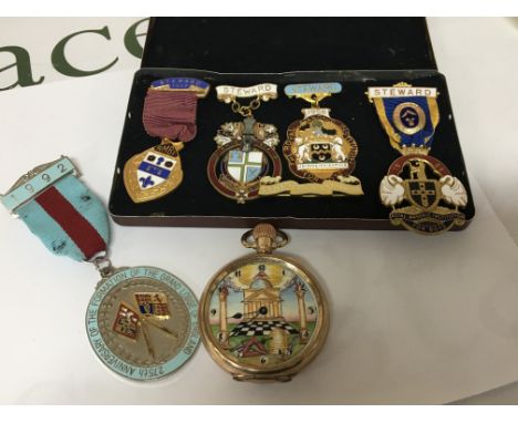 A Masonic gold plated pocket watch the dial with temple and Masonic symbolism full decorated dial the watch button wind seen 