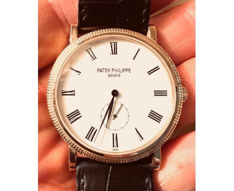 PATEK PHILIPPE CALATRAVA, 18ct ROSE GOLD, WHITE DIAL, BLACK LEATHER STRAP, MANUAL
FINE CONDITION AND IN WORKING ORDER