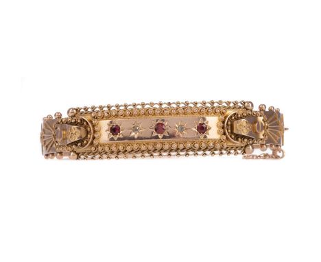 DIAMOND AND GEM SET BANGLE,the central panel decorated with beadwork, with red star set gems interspaced by old cut diamonds,