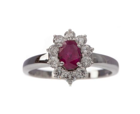 CERTIFICATED RUBY AND DIAMOND CLUSTER RING,the oval ruby of approximately 0.50 carats, with evidence of thermal enhancement, 