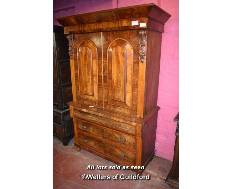 19TH CENTURY CONTINENTAL MAHOGANY LINEN PRESS, THE TWO PANELLED DOORS ENCLOSING TRAYS, OVER A CUSHION DRAWER AND TWO FURTHER 