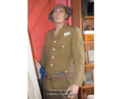 MALE MANNEQUIN WEARING GREEN ARMY UNIFORM; BLACK LEATHER BOOTS
