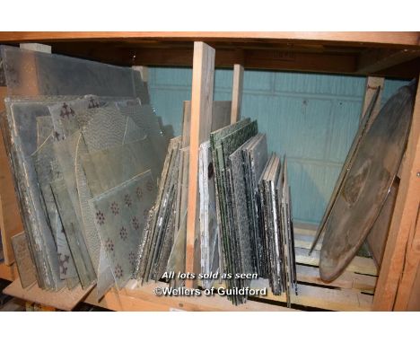 SHELF OF MIXED GLASS PANELS