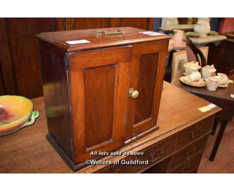 VICTORIAN MAHOGANY COLLECTORS CABINET WITH TWO PANELLED DOORS ENCLOSING A SHELF, BRASS CARRYING HANDLE, 45CM X 45CM X 25CM (1