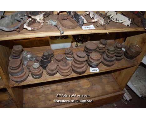 SHELF CONTAINING LARGE QUANTITY OF WEIGHTS